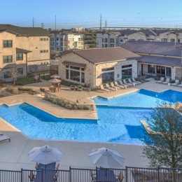 Resort-style swimming pool with lounge seating