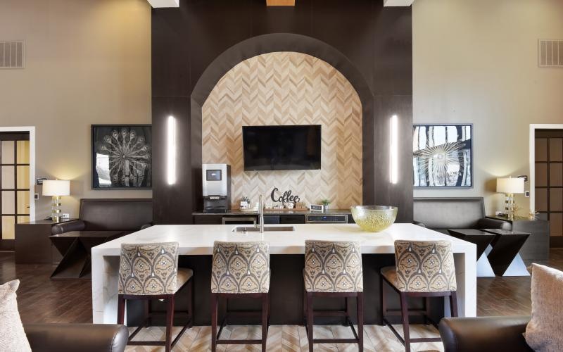 a room with a large table and chairs