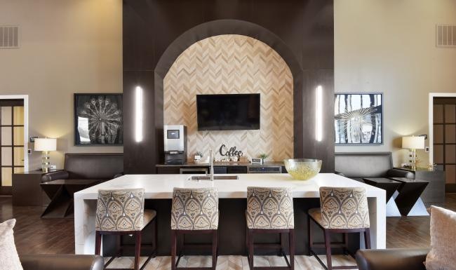 a room with a large table and chairs