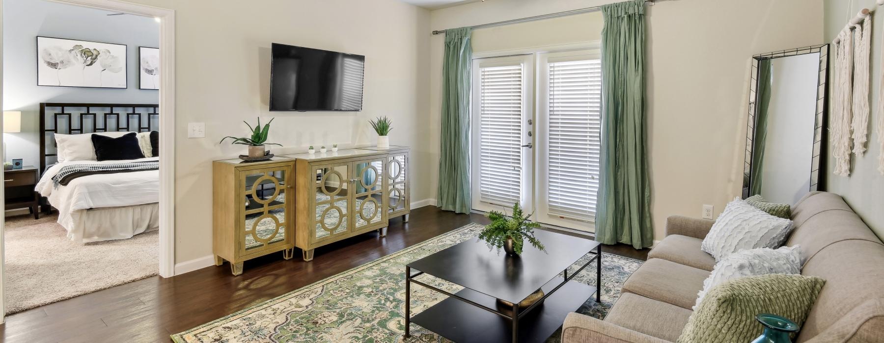 a living room with a bed and a couch